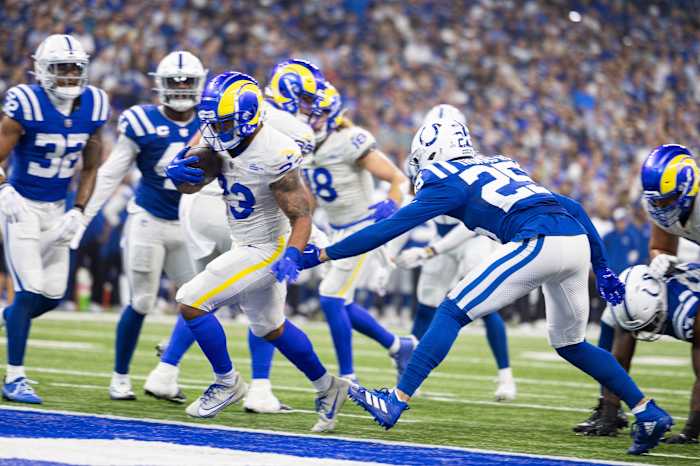 Los Angeles Rams running back Kyren Williams (23) runs for a touchdown while Indianapolis Colts safety Rodney Thomas II (25) defends in the first quarter at Lucas Oil Stadium.